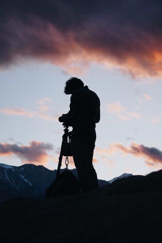 Photographer viewing mountain peaks My Employee Benefits Plus